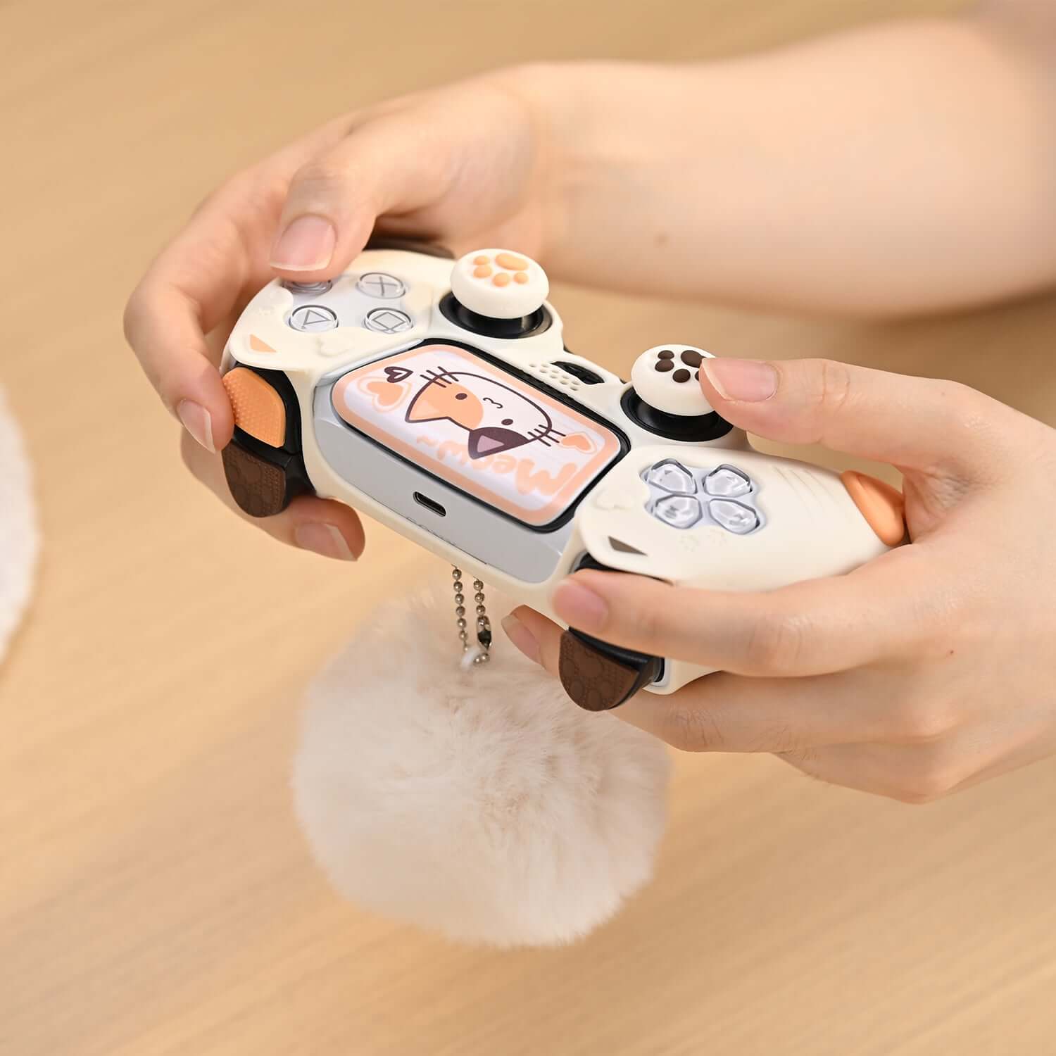 Person holding PS5 controller with GeekShare Calico Cat silicone skin, highlighting non-slip grip and stylish design.